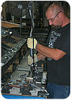 Handles, stationary bars, swing arms and other hardware components are built on subassembly lines