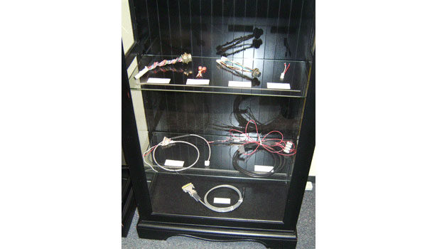 Harness slide show photo13.gif?alt=several+harnesses+are+displayed+in+a+glass+case+in+the+office