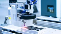 Robot holding glue syringe Injection with robotic machine vision system Robot holding glue syringe Injection with robotic machine vision system.