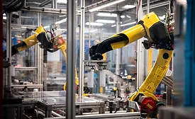 Multiple robotic arms synchronize on the water filter line at Appliance Park in Louisville KY.