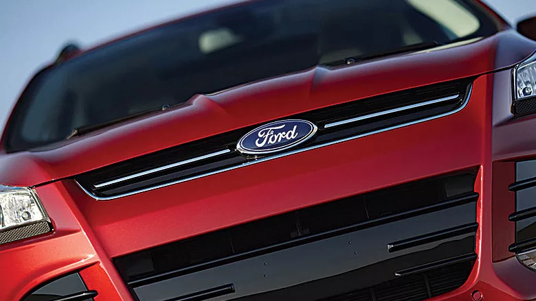 The blue Ford logo appearing on a red vehicle.