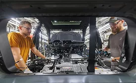 Automotive manufacturing line at Toyota Kentucky plant assembling vehicles with advanced production equipment