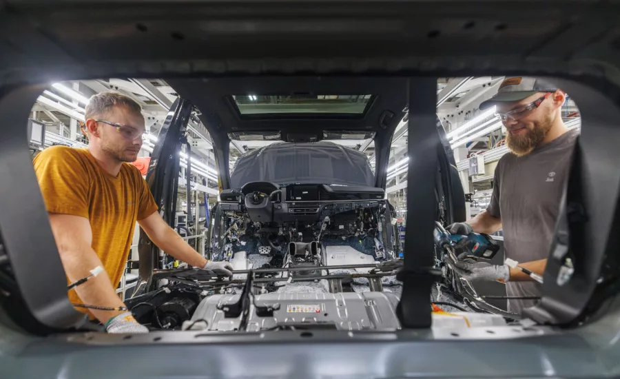 Automotive manufacturing line at Toyota Kentucky plant assembling vehicles with advanced production equipment