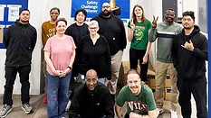 Medline North Mankato Minnesota manufacturing employees with Golden Cone Safety Award banner, medical product assembly workforce safety culture, U.S. healthcare manufacturing facility team recognition