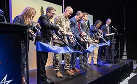 Lockheed Martin executives and officials cut a ribbon at the new missile assembly facility in Courtland, Alabama.