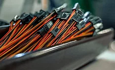 Wire Harness Connector Assemblies for Manufacturing Close-up of bundled wire harness connector assemblies with multiple colored wires and electrical connectors prepared for assembly operations.