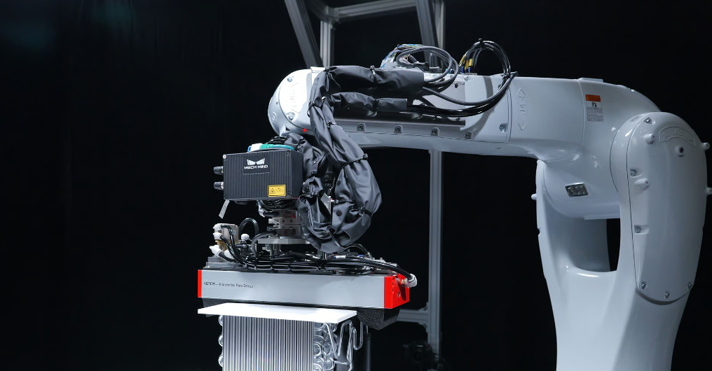 Industrial robotic arm equipped with a scanning and inspection system for automated quality control and manufacturing inspection applications.