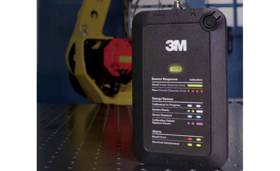 3M sensor device used for automated dispensing process monitoring and calibration, shown in front of an industrial robot within a manufacturing cell.