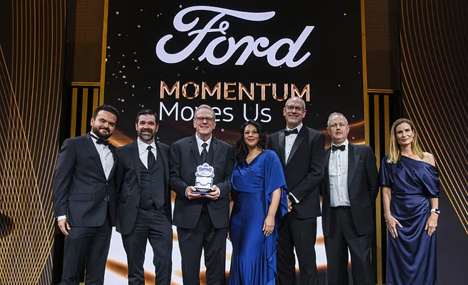 ABB Robotics representatives accept a 2026 Ford Supplier of the Year award at Ford’s Supplier Awards & Summit.