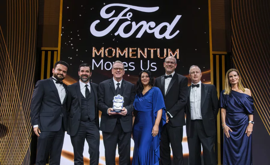 ABB Robotics representatives accept a 2026 Ford Supplier of the Year award at Ford’s Supplier Awards & Summit.