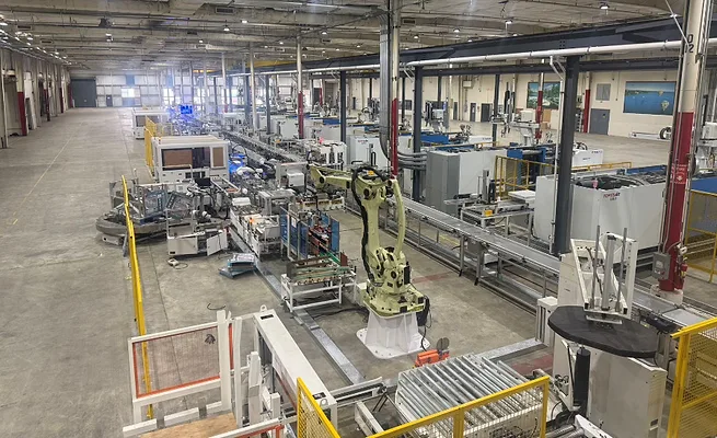 Automated box fan assembly line at Oobotic's Arkansas manufacturing facility featuring industrial robots, conveyors and advanced production equipment supporting U.S. appliance manufacturing. Automated appliance assembly line at Oobotic's Arkansas manufacturing facility featuring industrial robots, conveyors and automated production equipment for consumer appliance manufacturing.