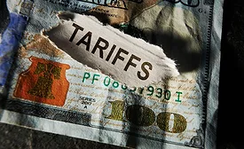 Illustration of U.S. 100 dollar bills representing the financial impact of tariffs on American households.