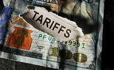Illustration of U.S. 100 dollar bills representing the financial impact of tariffs on American households.