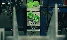 Conveyor Puts a Lid on Bottle-Cap-Assembly Problems