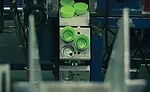 Conveyor Puts a Lid on Bottle-Cap-Assembly Problems