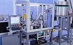 Automated System Fills, Caps Vials