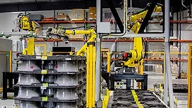 Robotic System Packages, Palletizes Automotive Wheels