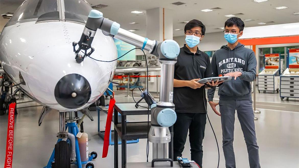 Nondestructive testing on an aircraft for cracks or defects.