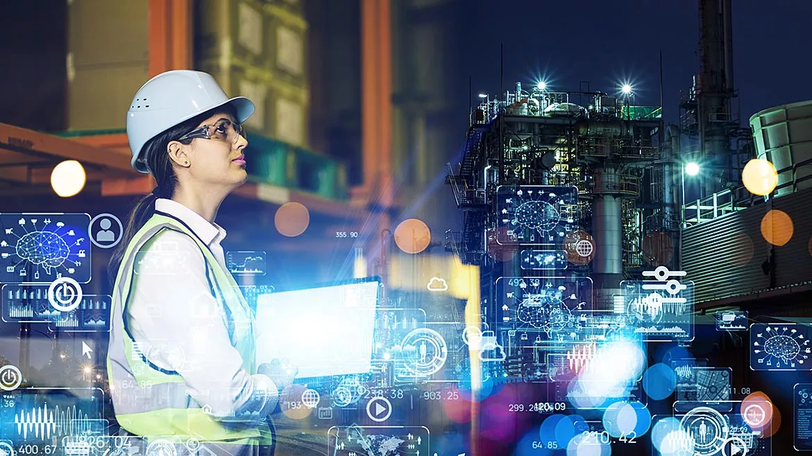 Female engineer working in the factory. Virtual technology concepts floating in front her.