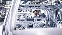 worker on auto assembly line worker on auto assembly line