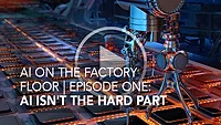 robotic arm placing circuit boards on assembly line