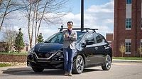 Dr. Chen and Electric Vehicle.jpg Dr. Chen and Electric Vehicle.jpg