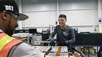 Kurt Kelty, vice president of battery, propulsion and sustainability at General Motors, assembles an EV battery pack.