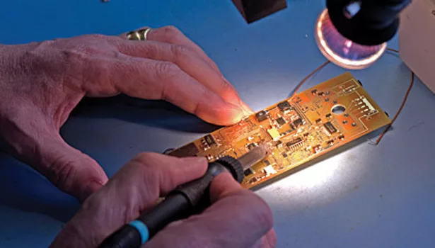electronics hands working joining fastening