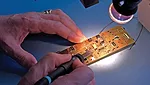 electronics hands working joining fastening