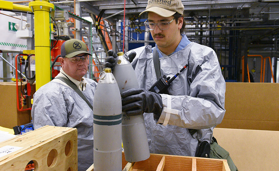 Ordnance technicians prepare mortar rounds for destruction