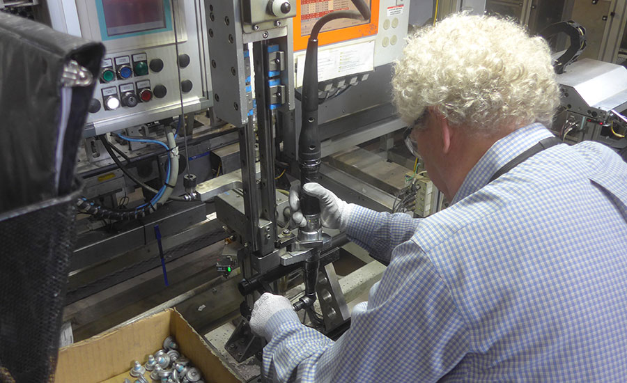 Austin Weber tries out a fastening tool on the assembly line at Brose Tuscaloosa