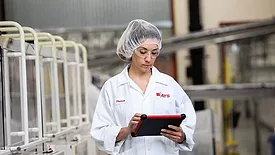 A technician uses a tablet with eFactoryPro
