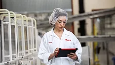 A technician uses a tablet with eFactoryPro