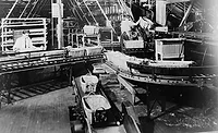 moving assembly line at Ford’s factory in Highland Park, MI