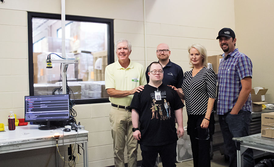 KANDU team with worker Andrew Updike