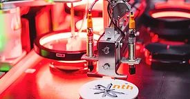 XPlanar mover manipulates a spring-loaded hook to release the diagnostics device