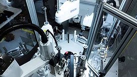 five-station automated assembly system