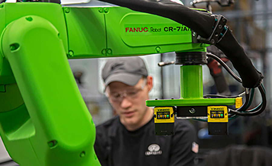 operator working with a collaborative robot