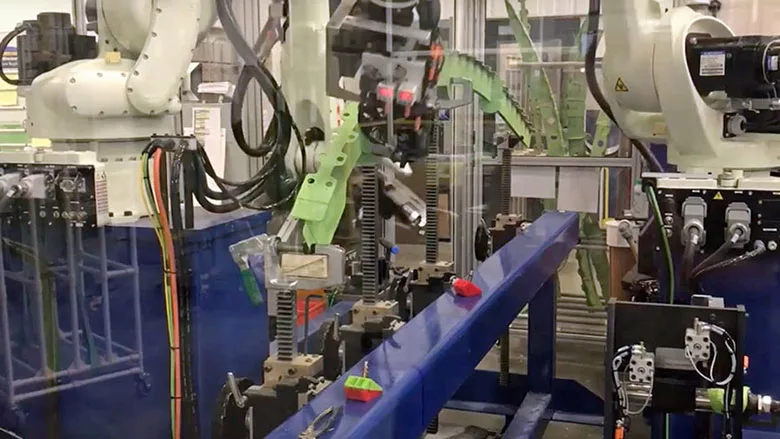 six-axis robots rivet nut plates onto a fuselage component