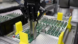 adaptive gripper handling a circuit board
