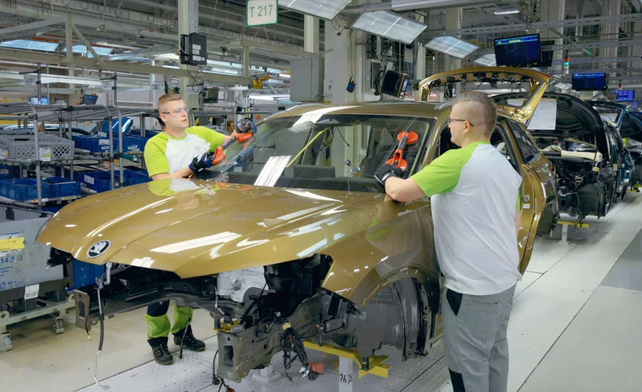 assemblers installing a windshield