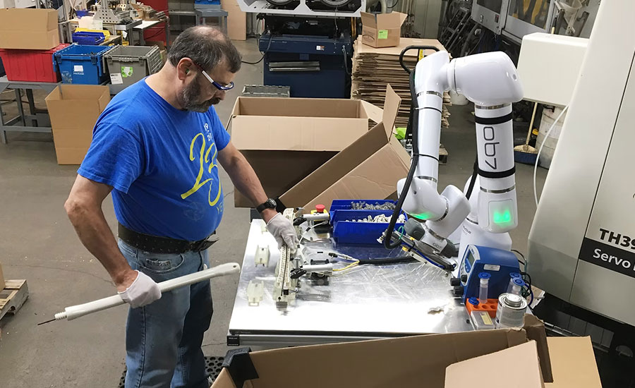 man works with cobot