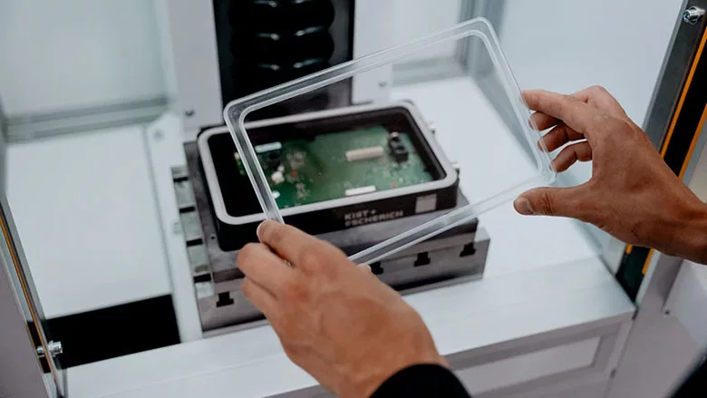 attaching a plastic cover to a metal housing
