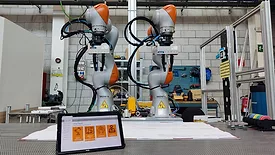 two cobots from Kuka Robotics