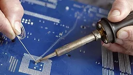 soldering a component onto a circuit board