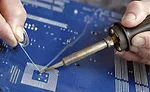soldering a component onto a circuit board