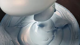 distributing heat-conductive particles throughout the material