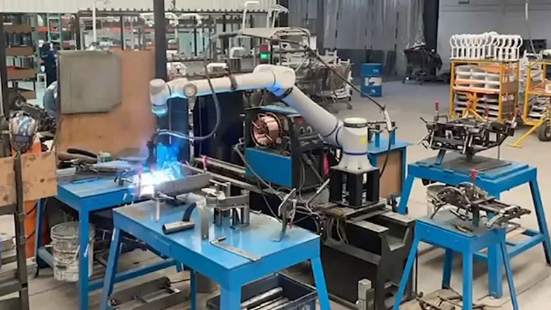 welding cobot mounted to a linear rail