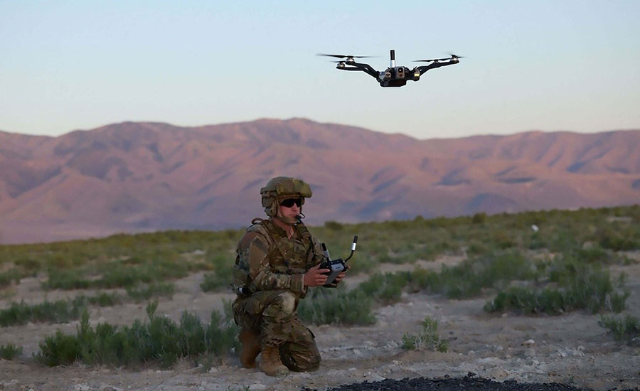 soldier flying a military drone