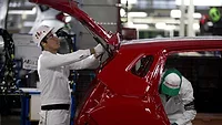 workers at a Honda assembly plant workers at a Honda assembly plant